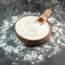 front-close-view-white-flour-with-wooden-spoon-inside-outside-brown-bowl-gray-background_140725-131041